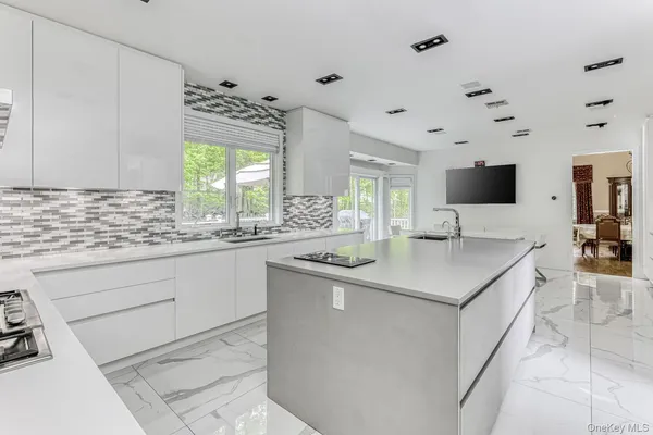 a kitchen with a sink and cabinets