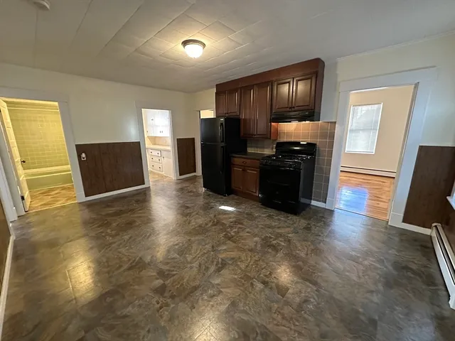 a kitchen with a stove and a refrigerator