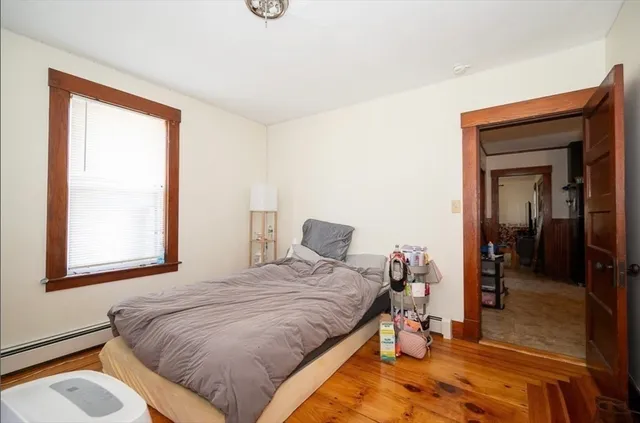 a bedroom with a bed and a closet