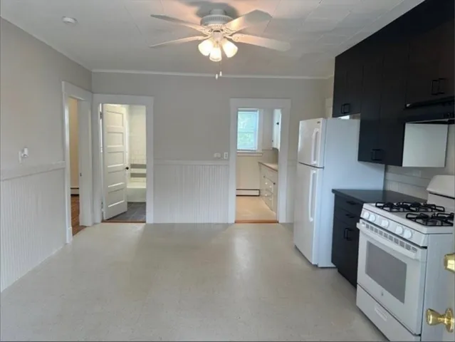 a view of kitchen and wooden floor