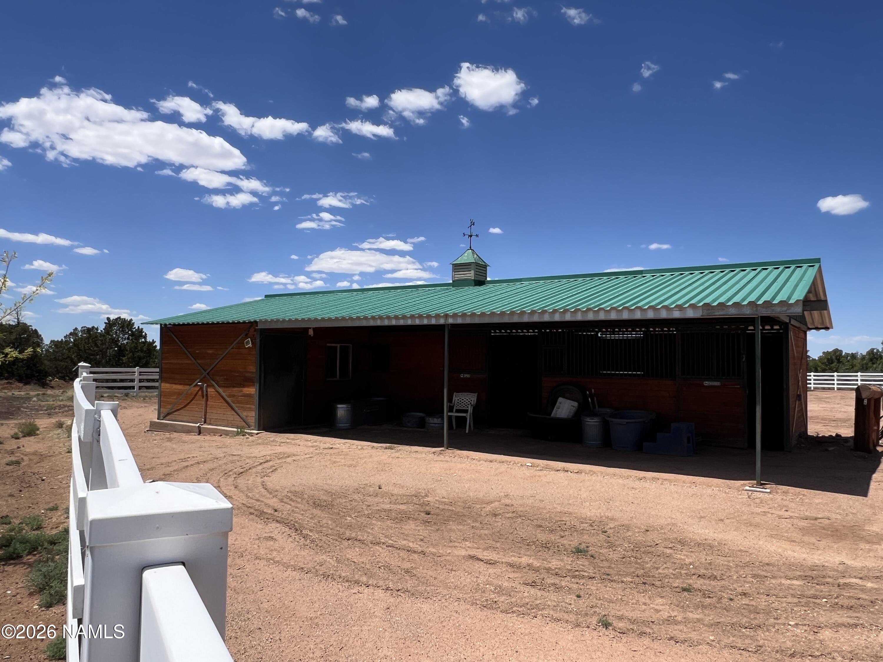 8348 Red Butte Road Williams, AZ 86046 - Photo 30 of 89 a front view of a house with a yard and garage