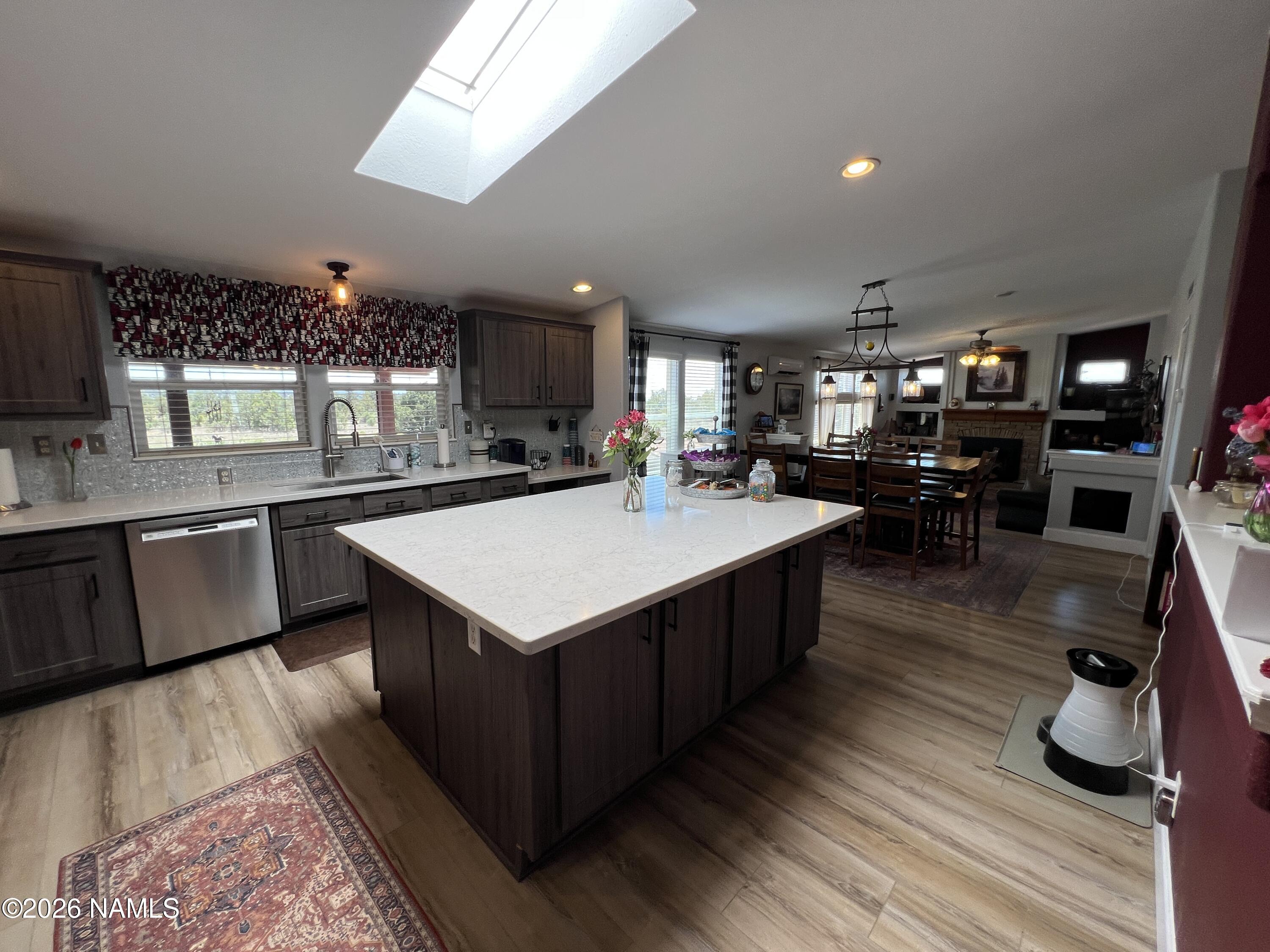 8348 Red Butte Road Williams, AZ 86046 - Photo 42 of 89 a kitchen with a sink counter top space and stainless steel appliances