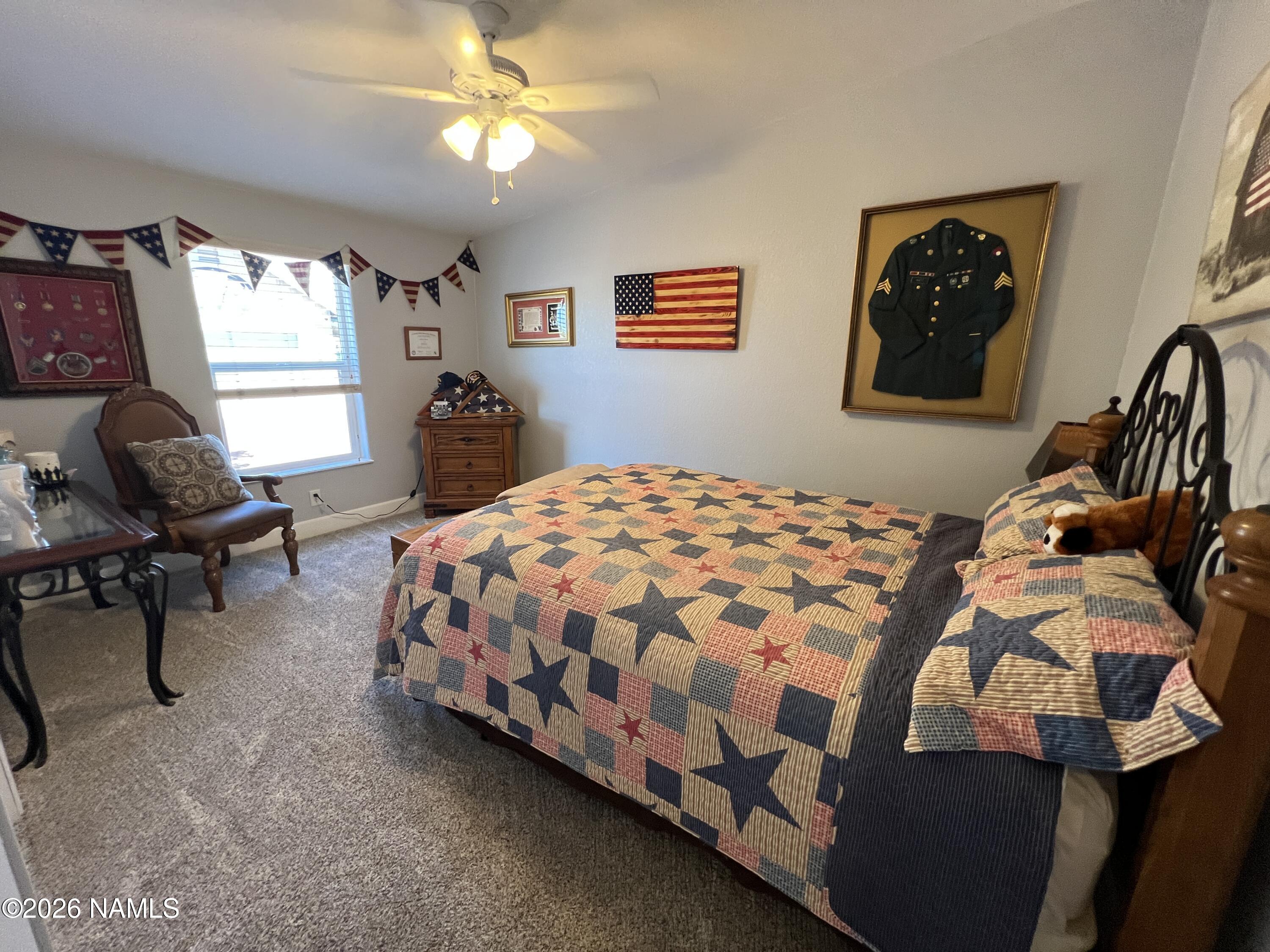8348 Red Butte Road Williams, AZ 86046 - Photo 58 of 89 a bedroom with a bed chair and window