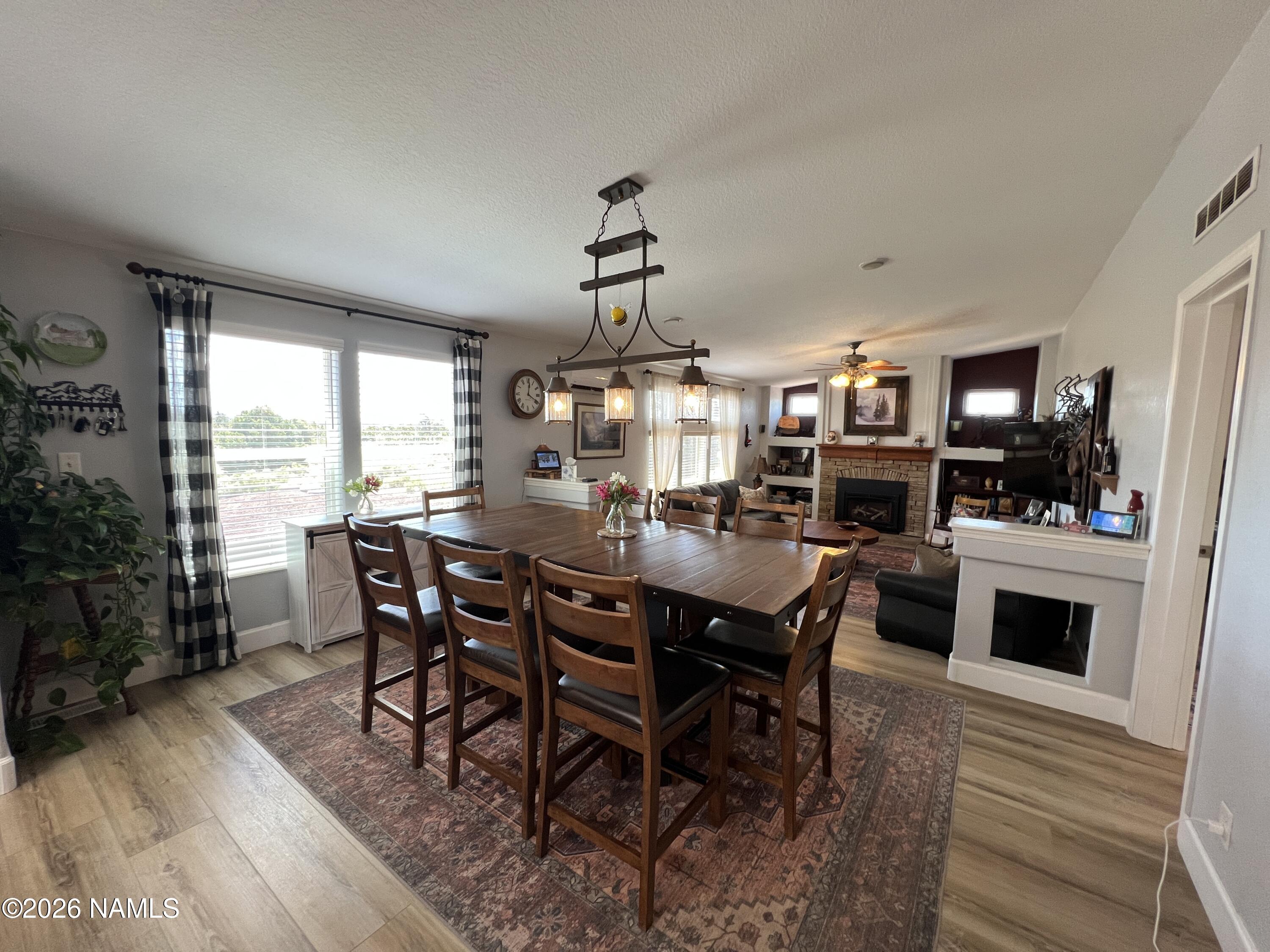 8348 Red Butte Road Williams, AZ 86046 - Photo 75 of 89 a view of a dining room with furniture window and wooden floor