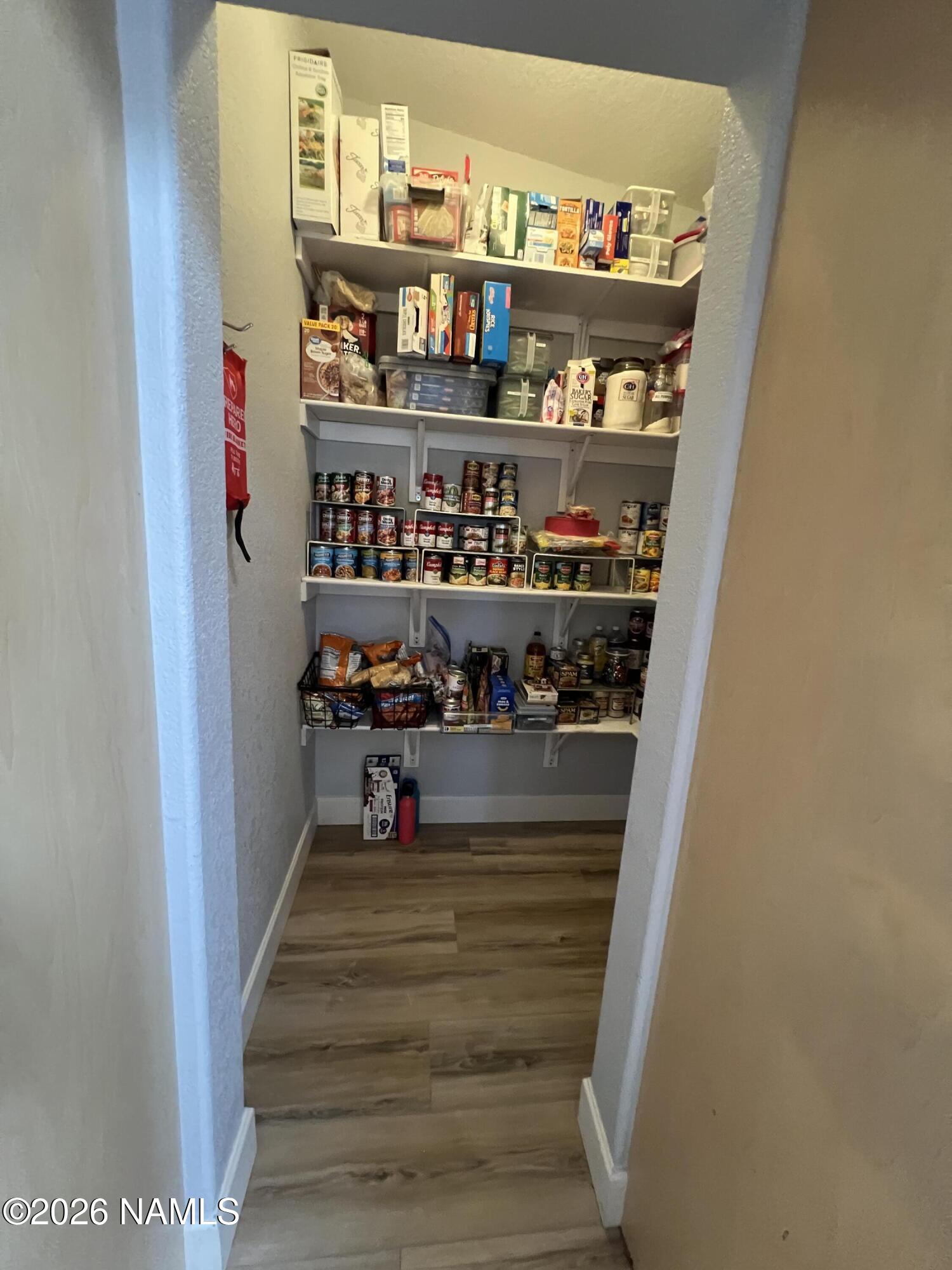 8348 Red Butte Road Williams, AZ 86046 - Photo 79 of 89 a view of walk in closet with clothes and shoes