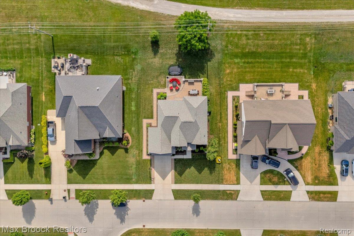 1126 Queensboro Drive Rochester, MI 48307 - Photo 62 of 66 Aerial perspective highlighting a residential street with well-maintained lawns