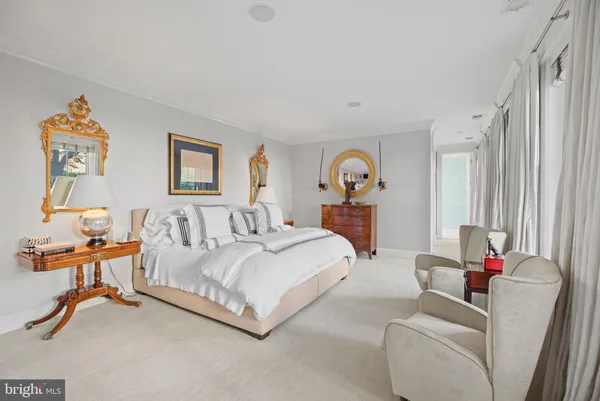 a bedroom with bed and a couch