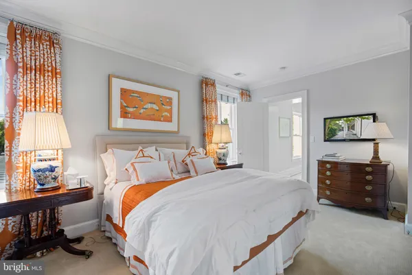 a bed room with a bed and a dresser
