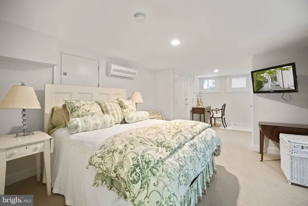 a bedroom with a bed and a lamp