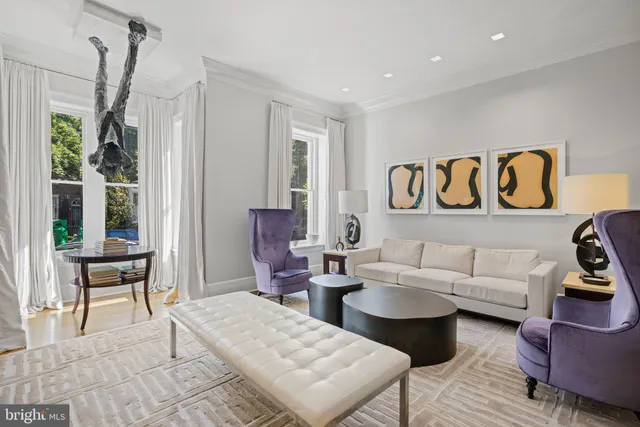 a living room with furniture and a table