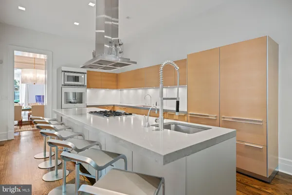 a kitchen with a sink cabinets and window