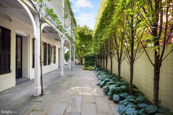 a view of a pathway both side of house