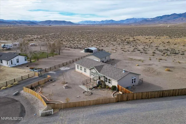 a view of swimming pool with outdoor seating and yard in back