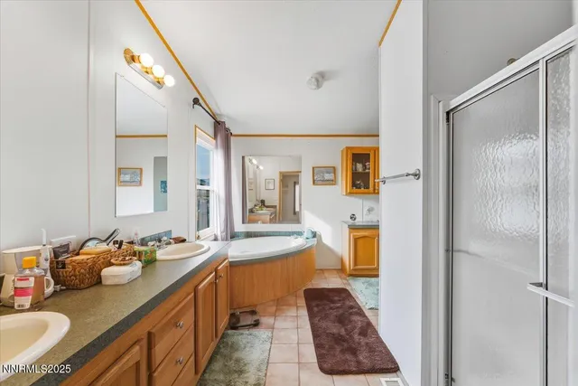 a view of house with garage and a yard