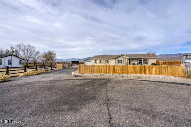 a view of swimming pool in front of residential houses
