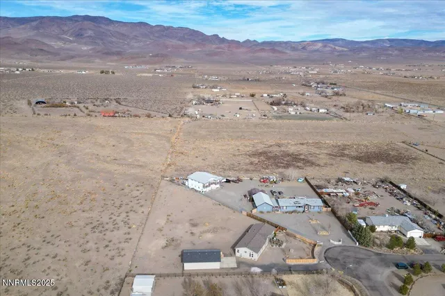 an aerial view of houses with outdoor space