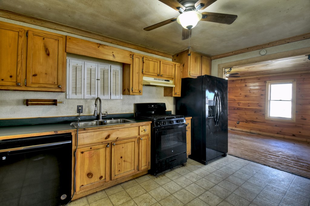 1388 East Main Street Blue Ridge, GA 30513 - Photo 3 of 19 a kitchen with stainless steel appliances granite countertop a refrigerator a stove a sink and dishwasher