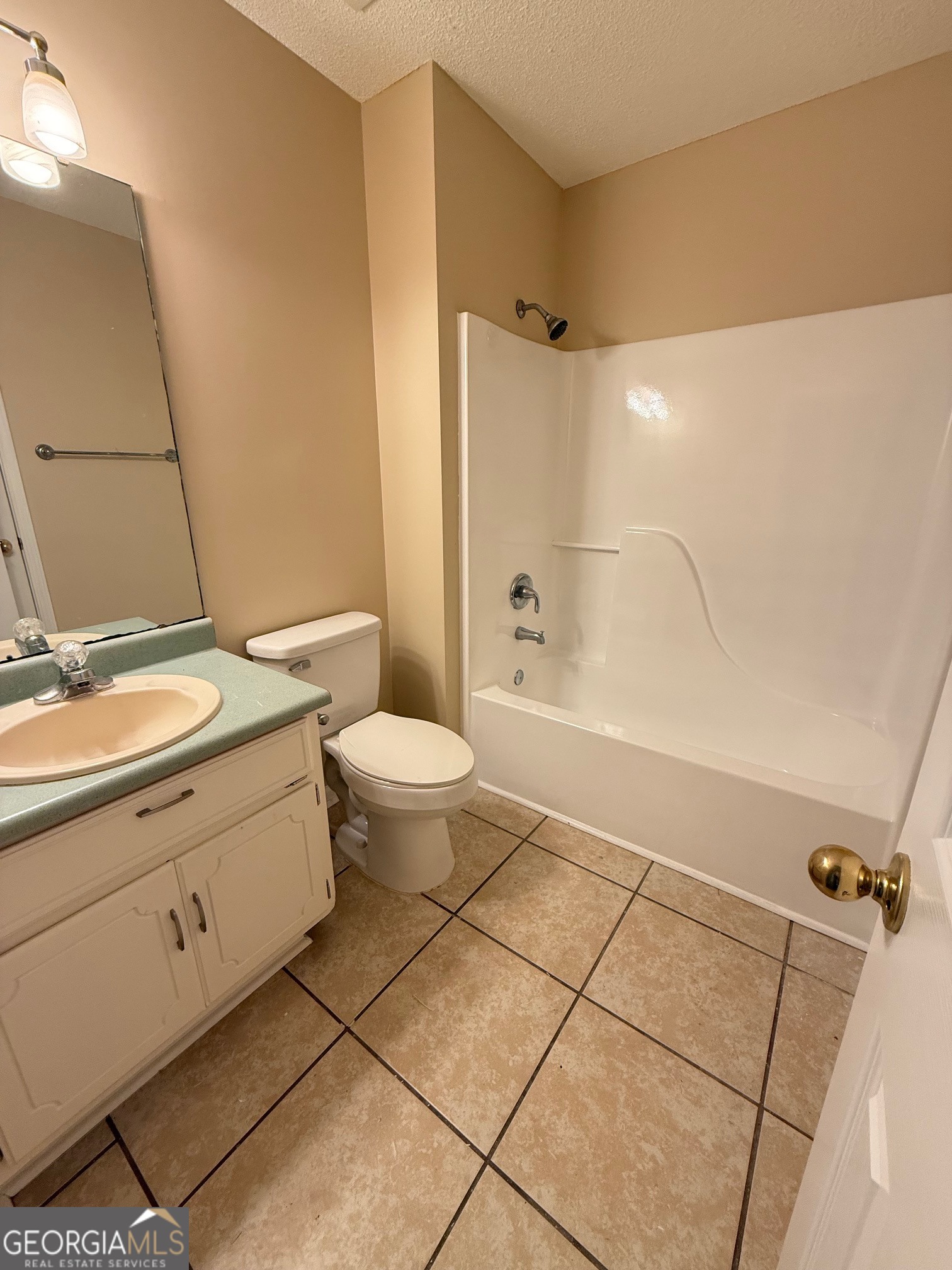 504 Woodbridge Road Kingsland, GA 31548 - Photo 17 of 23 a bathroom with a granite countertop sink mirror vanity and toilet