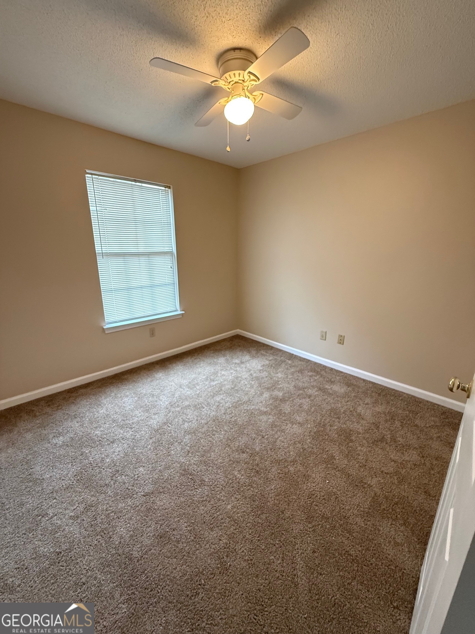 504 Woodbridge Road Kingsland, GA 31548 - Photo 18 of 23 an empty room with windows and fan