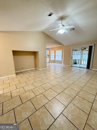 a view of an empty room and window