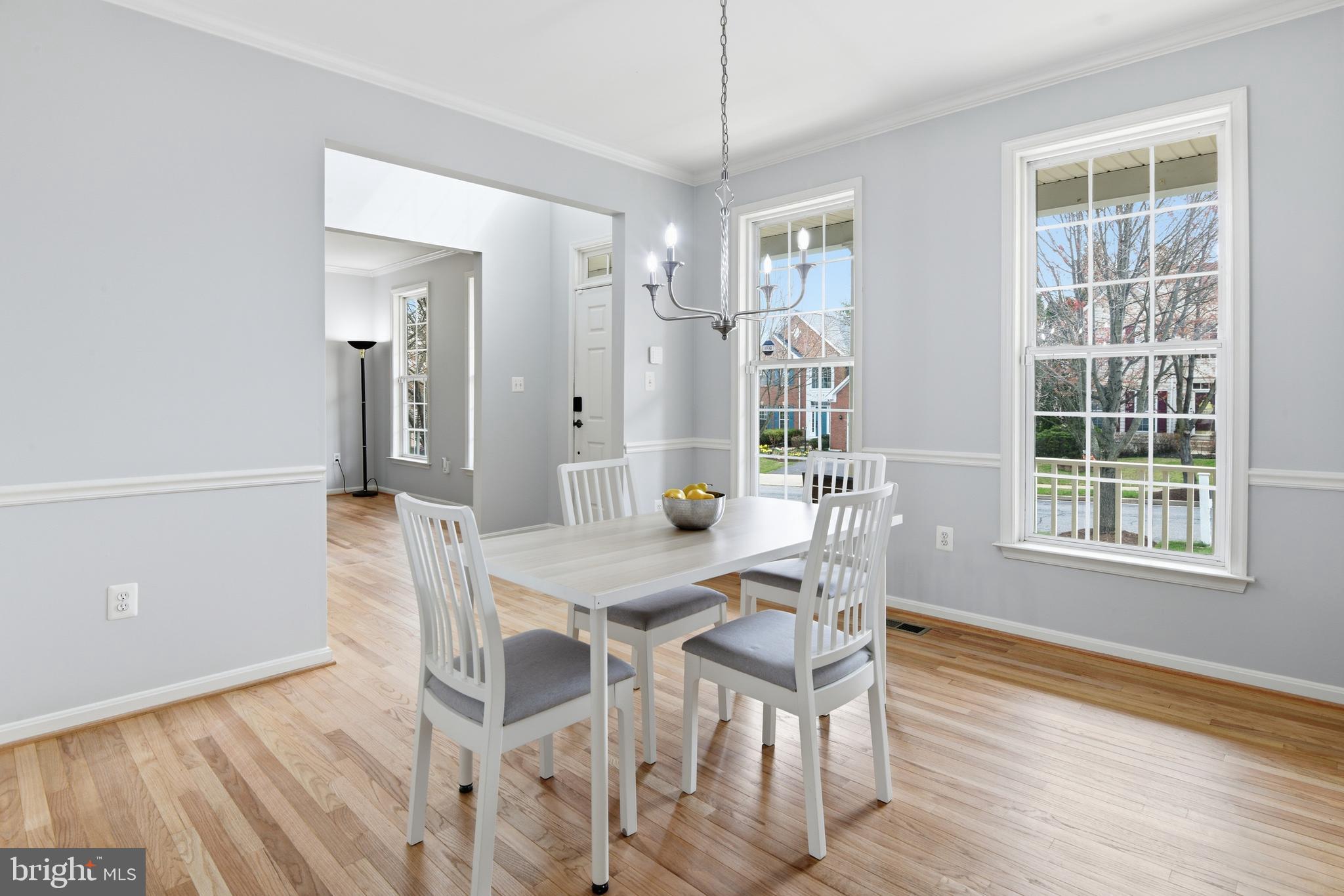 9044 Clendenin Way Frederick, MD 21704 - Photo 13 of 50 a view of a dining room with furniture and wooden floor