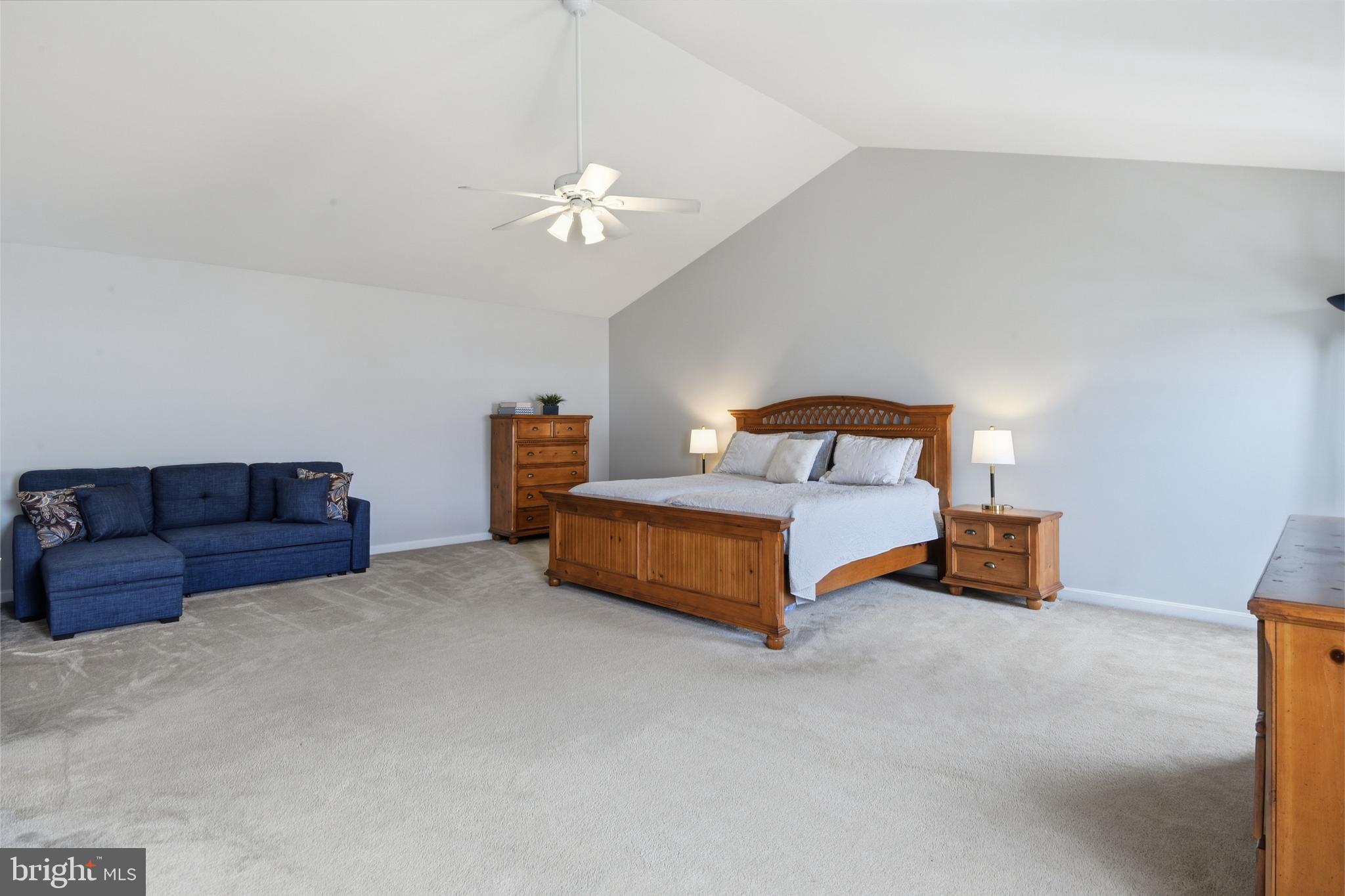 9044 Clendenin Way Frederick, MD 21704 - Photo 18 of 50 a bedroom with furniture and a couch