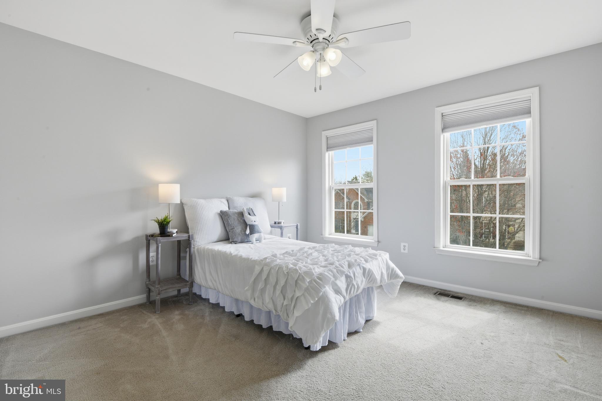 9044 Clendenin Way Frederick, MD 21704 - Photo 23 of 50 a spacious bedroom with a bed and a window