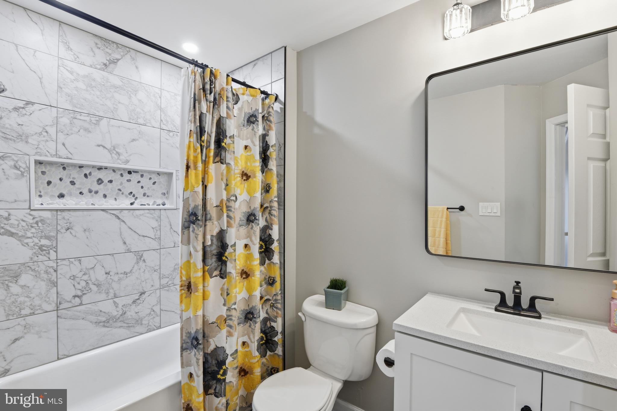 9044 Clendenin Way Frederick, MD 21704 - Photo 25 of 50 a bathroom with a sink and a mirror