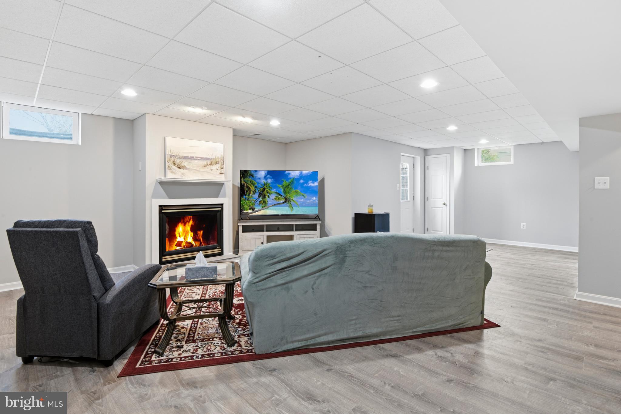 9044 Clendenin Way Frederick, MD 21704 - Photo 27 of 50 a living room with furniture and a fireplace