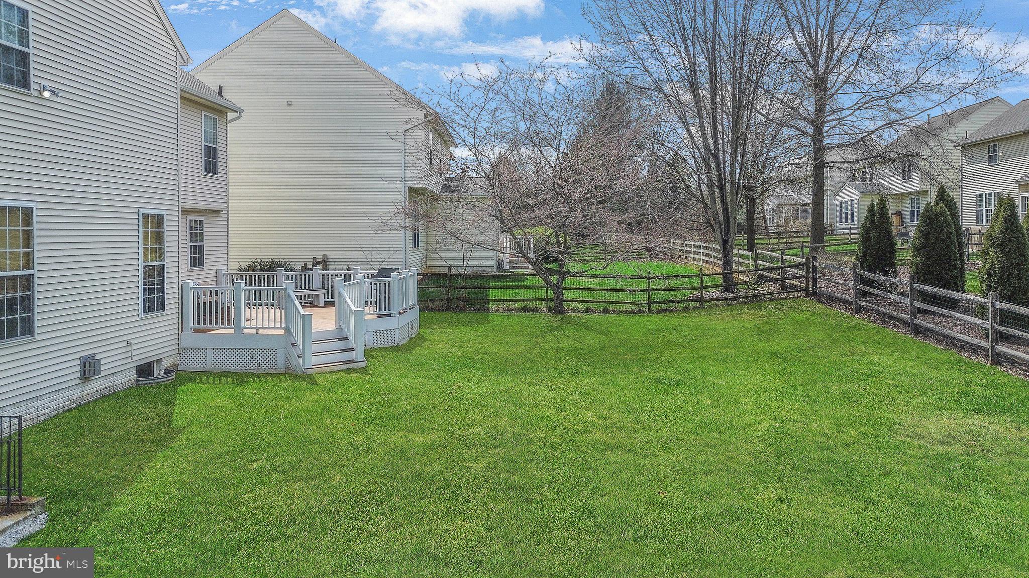 9044 Clendenin Way Frederick, MD 21704 - Photo 33 of 50 a view of a chair and table in back yard of the house