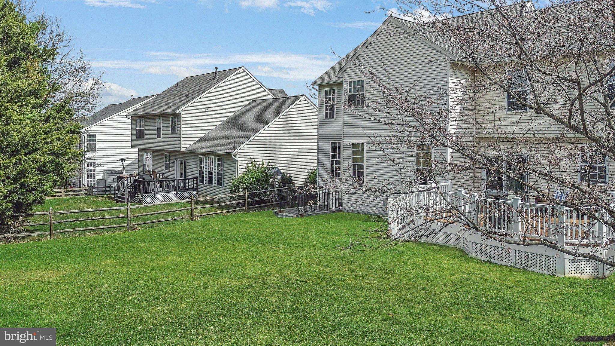 9044 Clendenin Way Frederick, MD 21704 - Photo 34 of 50 a view of a house with a yard and sitting area