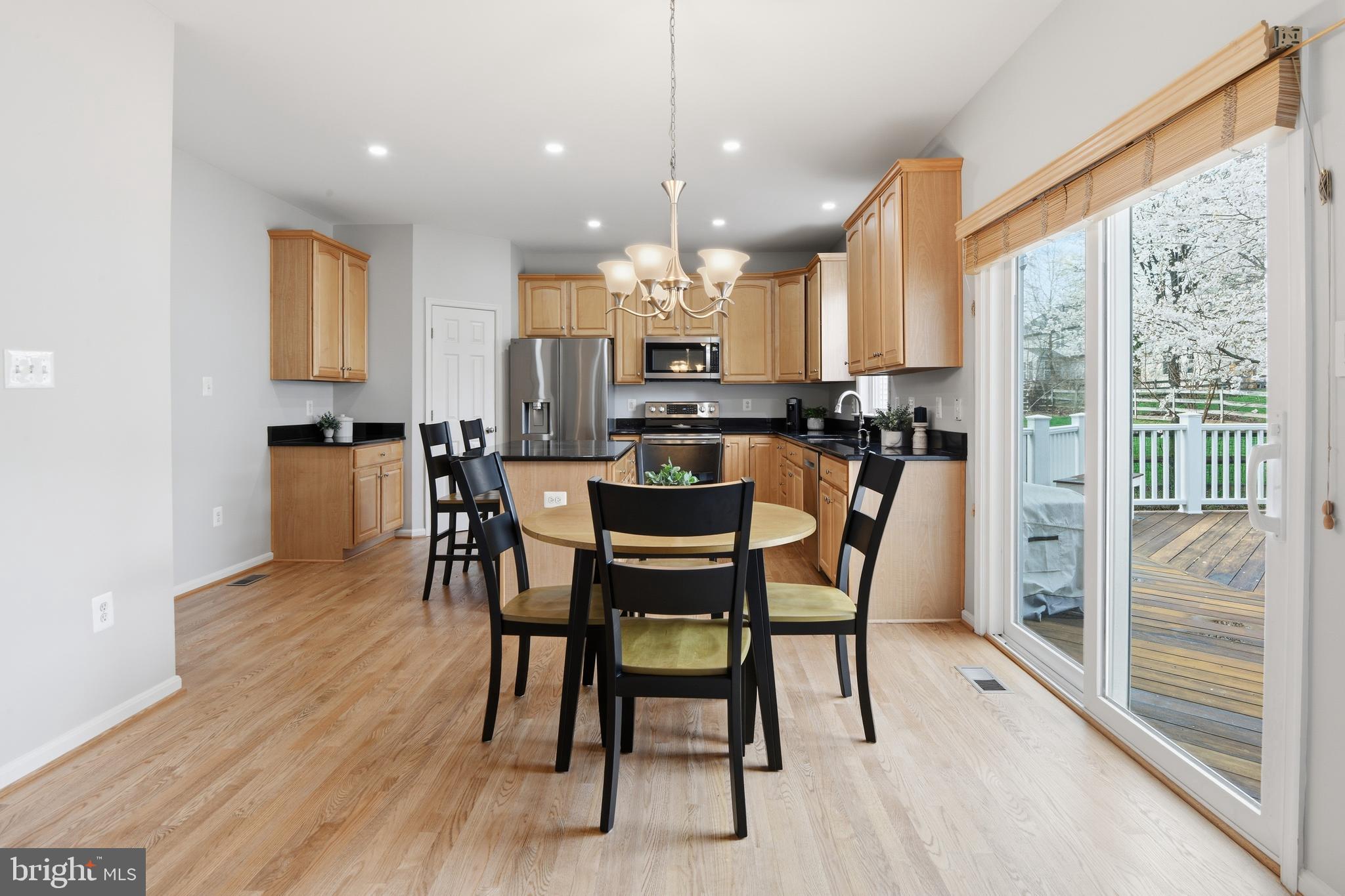 9044 Clendenin Way Frederick, MD 21704 - Photo 7 of 50 a view of a dining room with furniture window and wooden floor