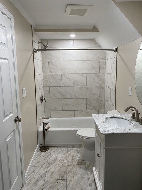 112 Langley Road Newton, MA 02459 - Photo 8 of 14 a bathroom with a granite countertop sink toilet and shower