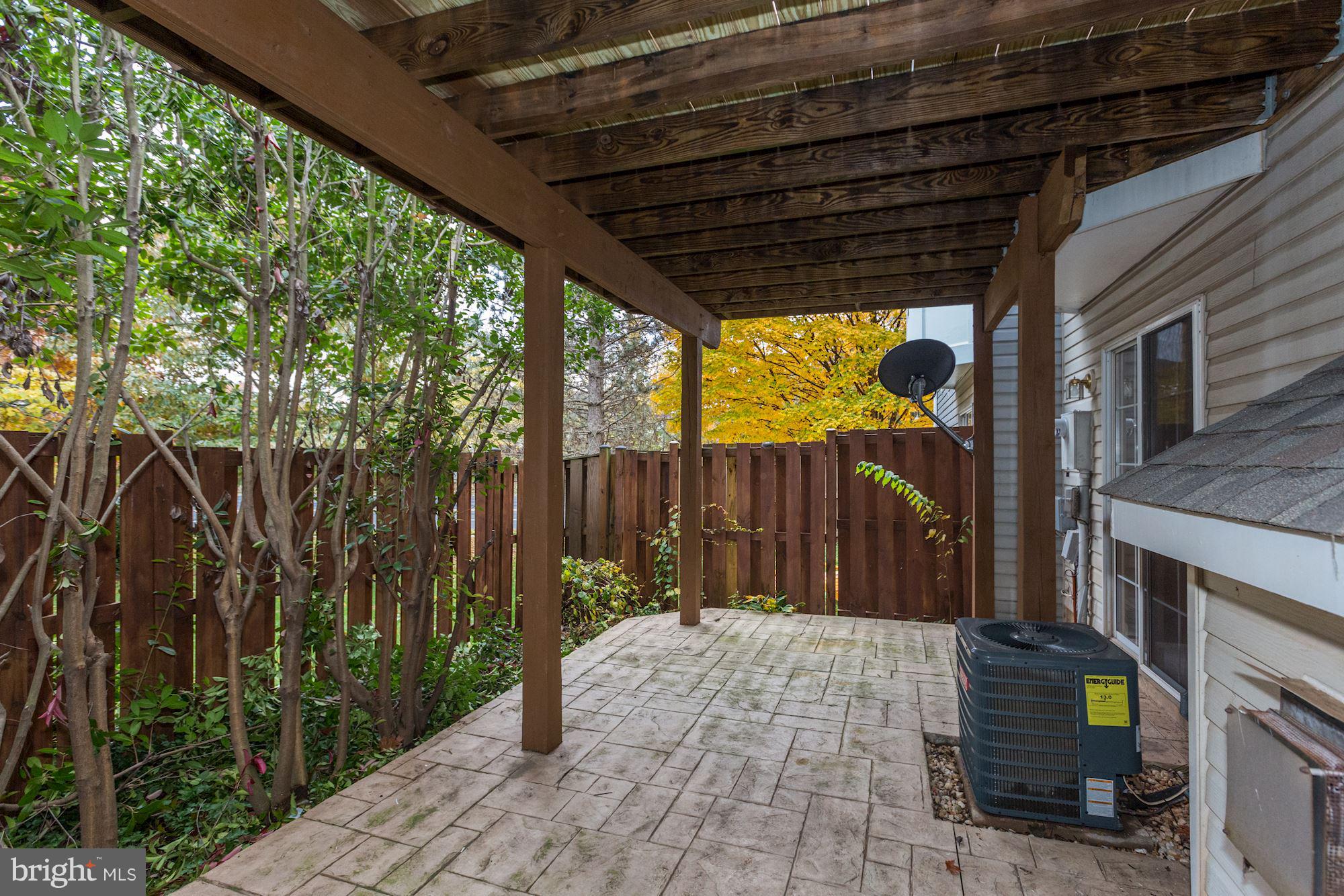 47692 Woolcott Square Sterling, VA 20165 - Photo 28 of 30 Fenced in Patio with designer brick stone