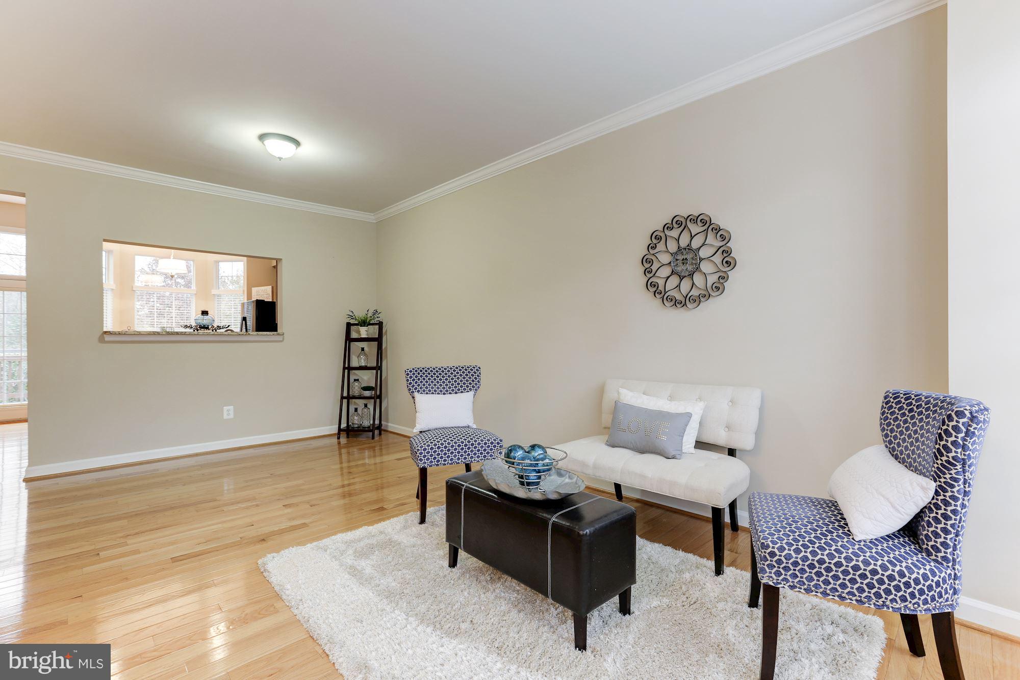 47692 Woolcott Square Sterling, VA 20165 - Photo 4 of 30 Living room leading to dining area