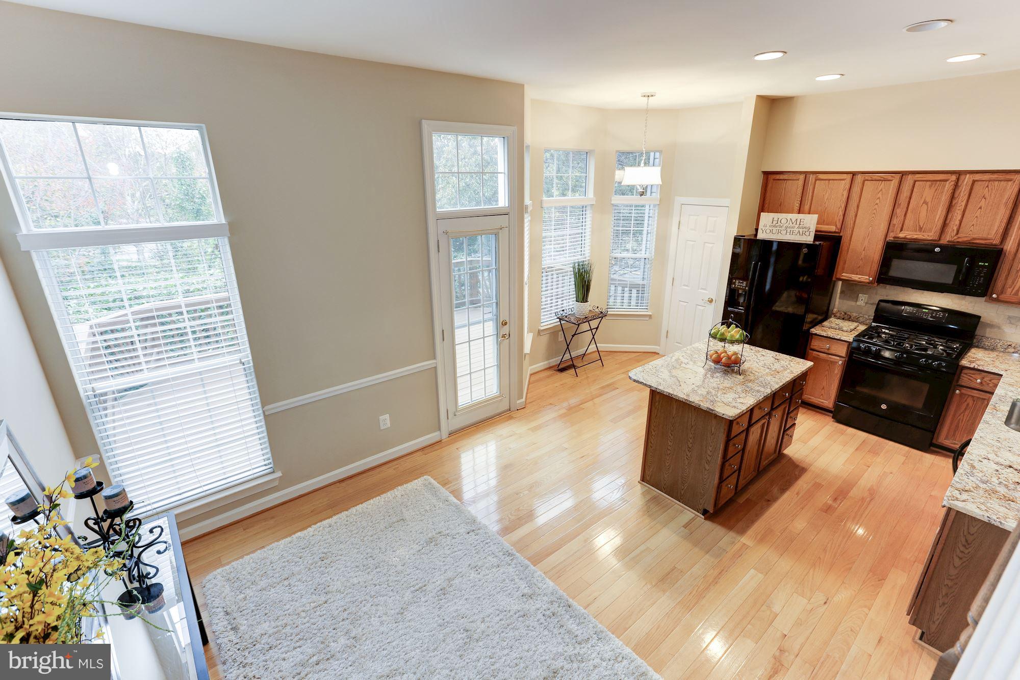 47692 Woolcott Square Sterling, VA 20165 - Photo 8 of 30 Family room leads to kitchen