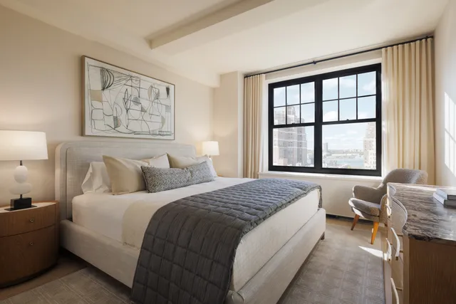 a bedroom with bed and a window