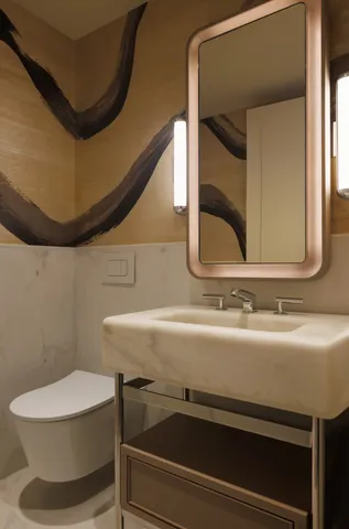 a bathroom with a toilet and a sink
