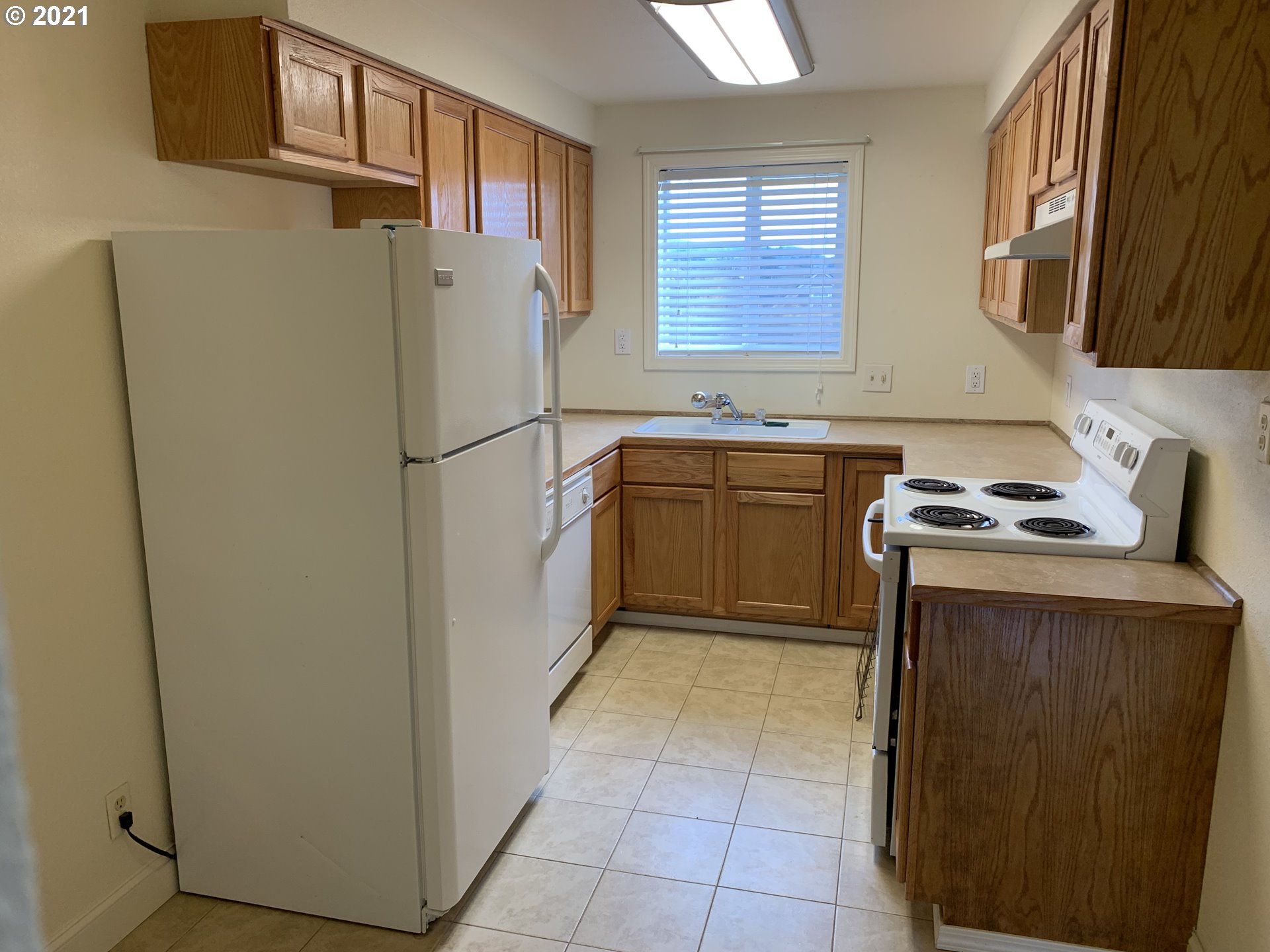 410 Southwest Mill Street Sheridan, OR 97378 - Photo 20 of 25 a white refrigerator freezer sitting inside of a kitchen
