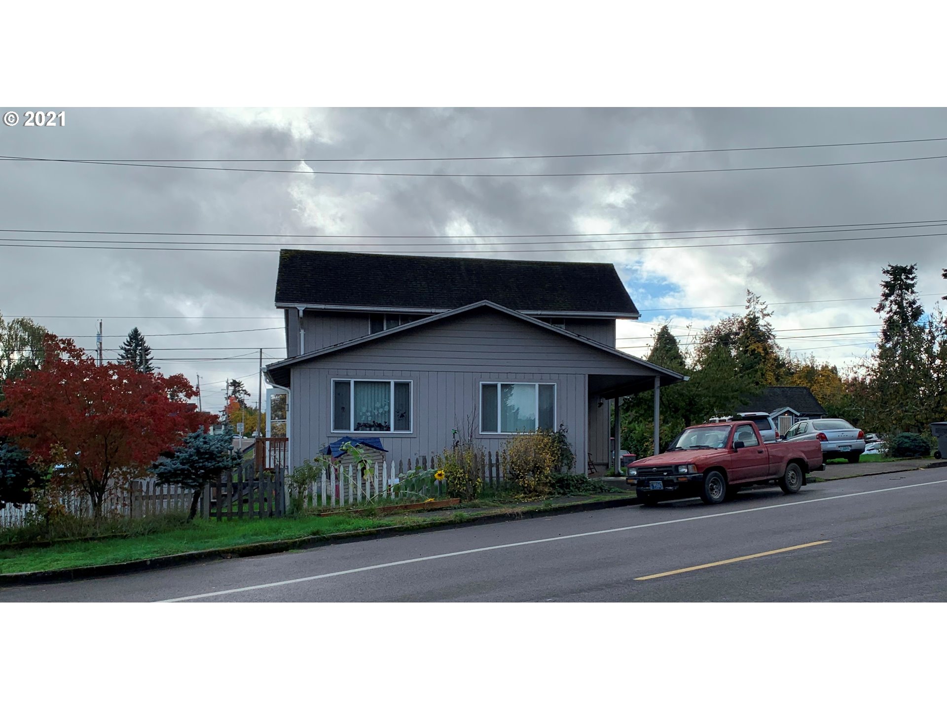 410 Southwest Mill Street Sheridan, OR 97378 - Photo 3 of 25 a street view along with parked cars