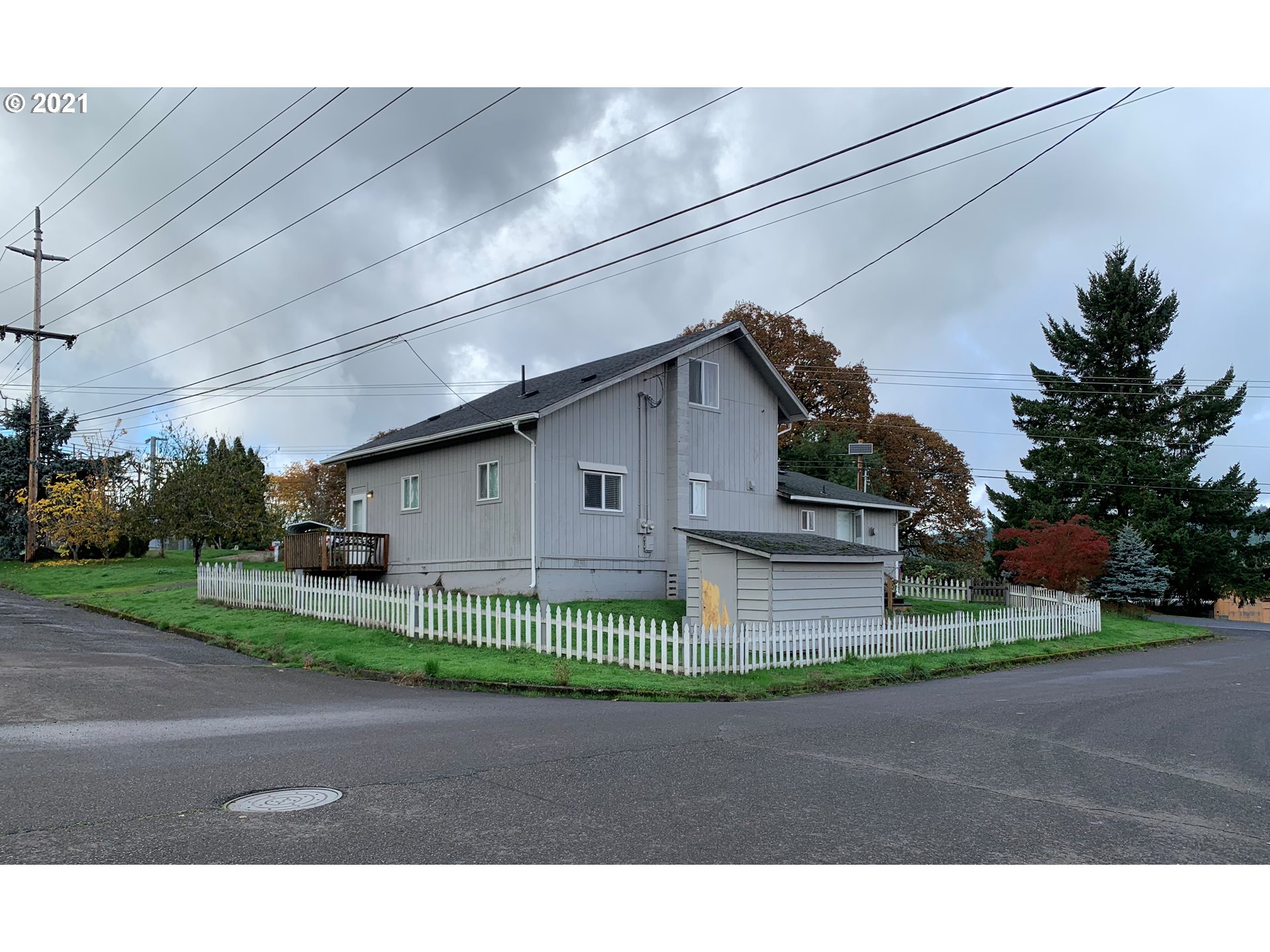 410 Southwest Mill Street Sheridan, OR 97378 - Photo 5 of 25 a view of a house with a yard and garage