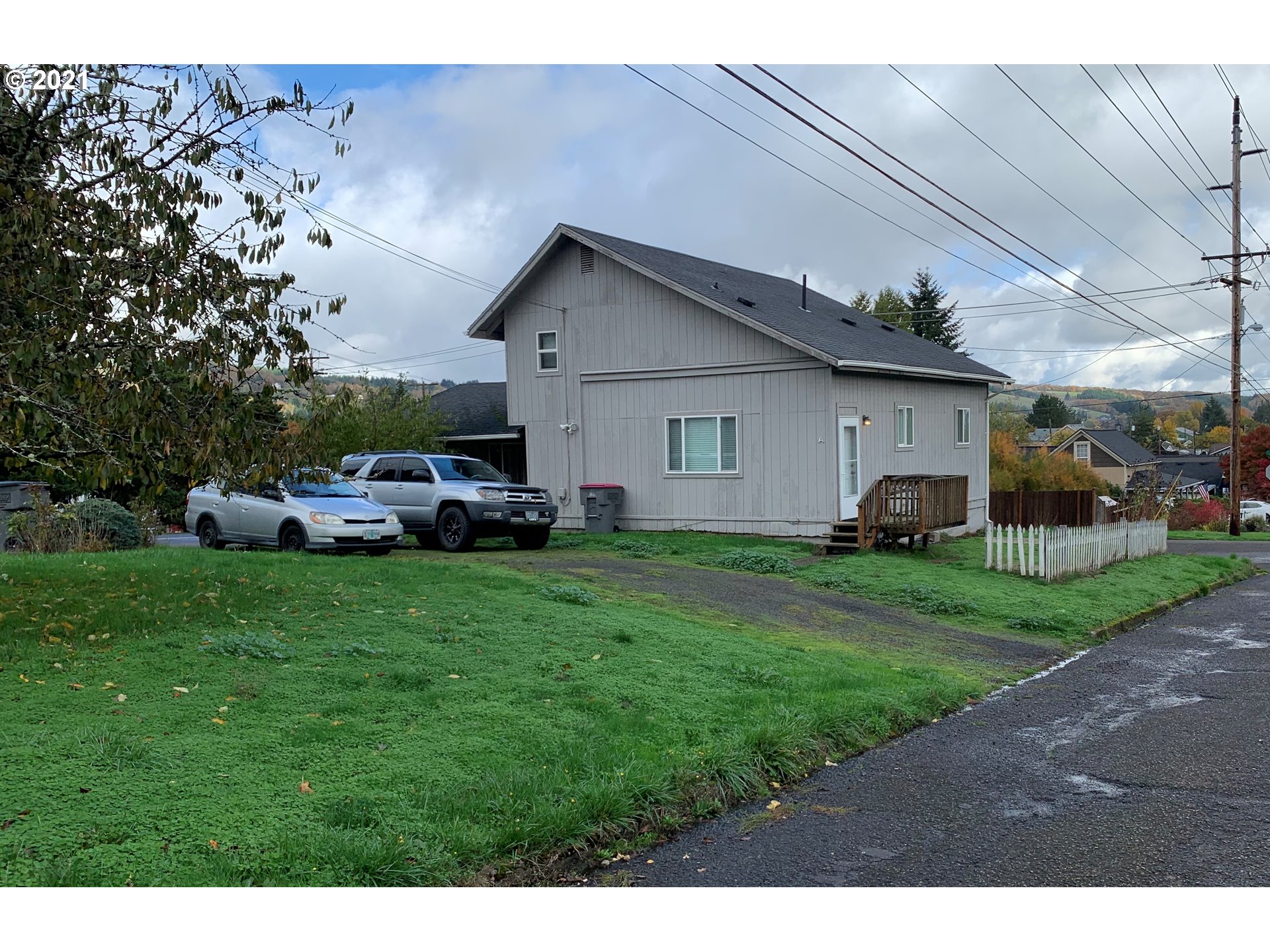 410 Southwest Mill Street Sheridan, OR 97378 - Photo 8 of 25 a front view of house with yard and car parked