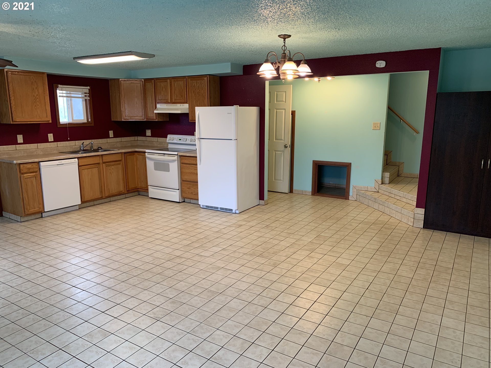 410 Southwest Mill Street Sheridan, OR 97378 - Photo 10 of 25 a kitchen with cabinets and white stainless steel appliances
