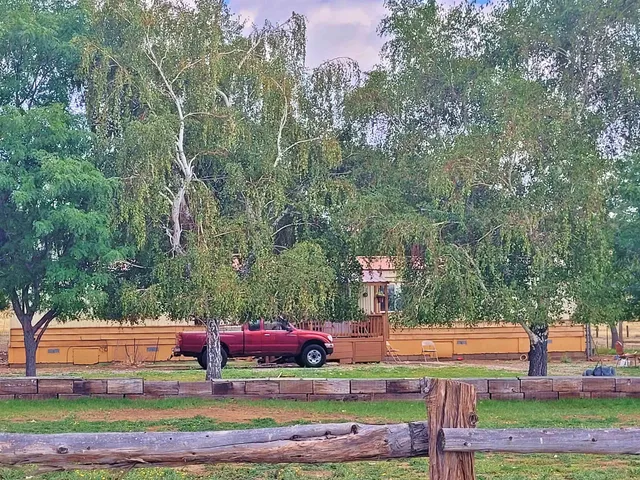 a view of a yard with an outdoor seating
