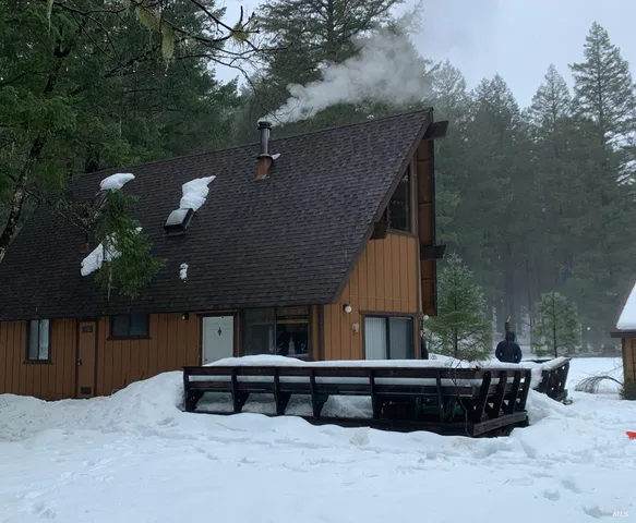 a building outdoor space with patio furniture and potted plants