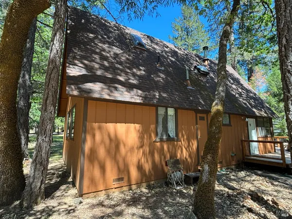 a view of a house with a tree