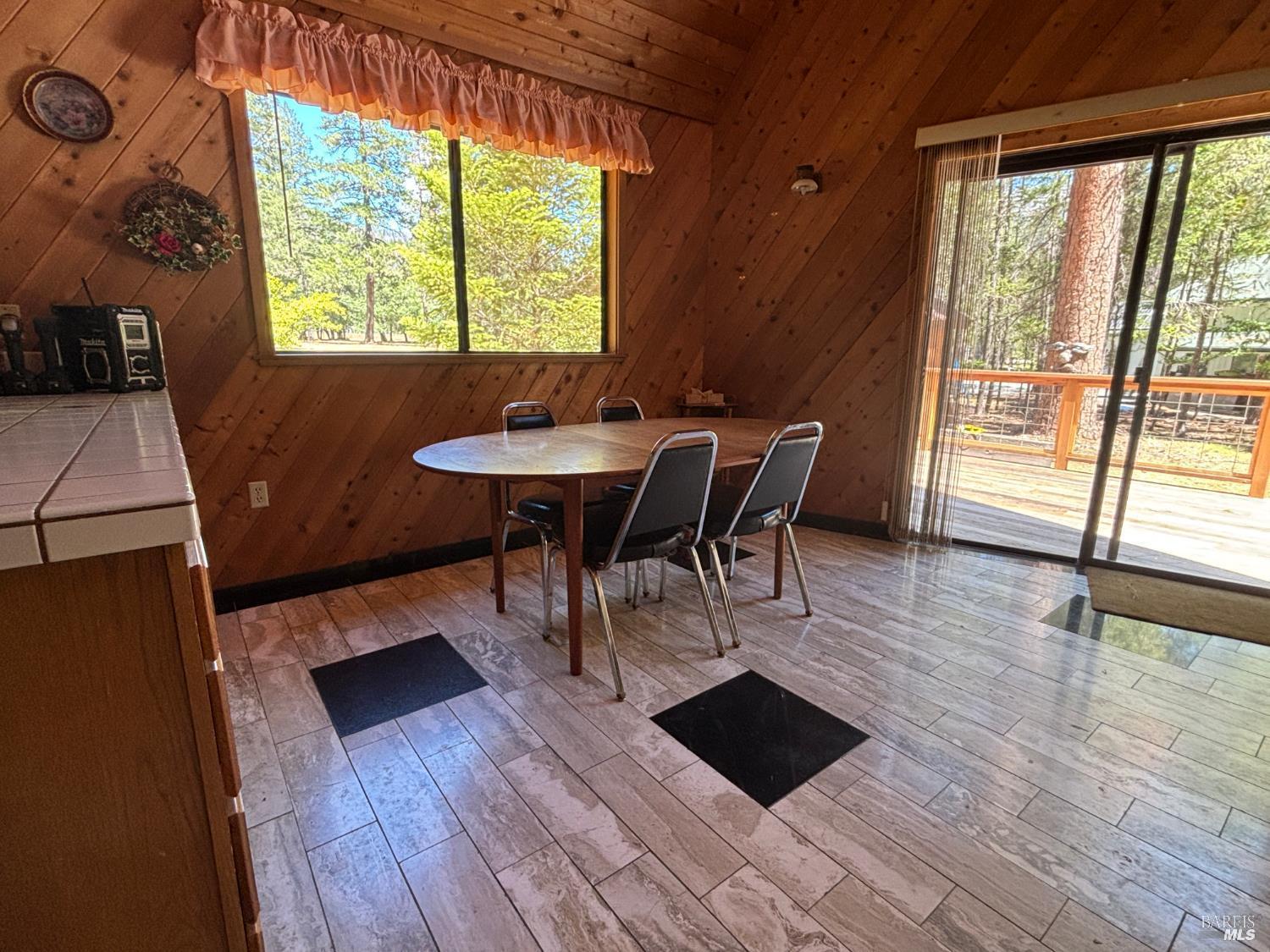 30518 Rodeo Road Potter Valley, CA 95469 - Photo 6 of 35 a view of a dining room with furniture and wooden floor