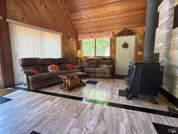 a living room with furniture window and wooden floor