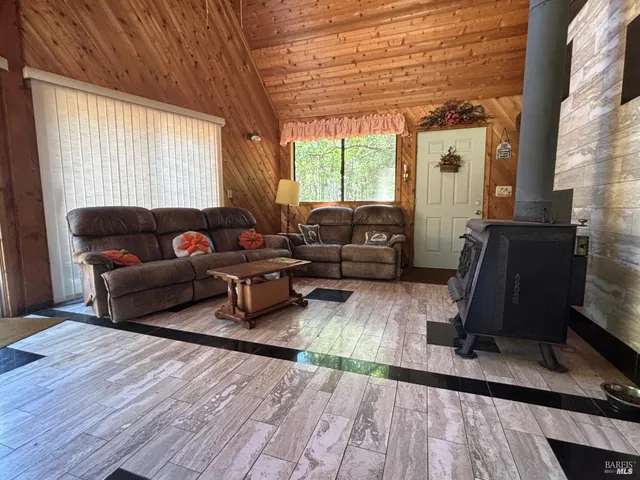 a living room with furniture window and wooden floor