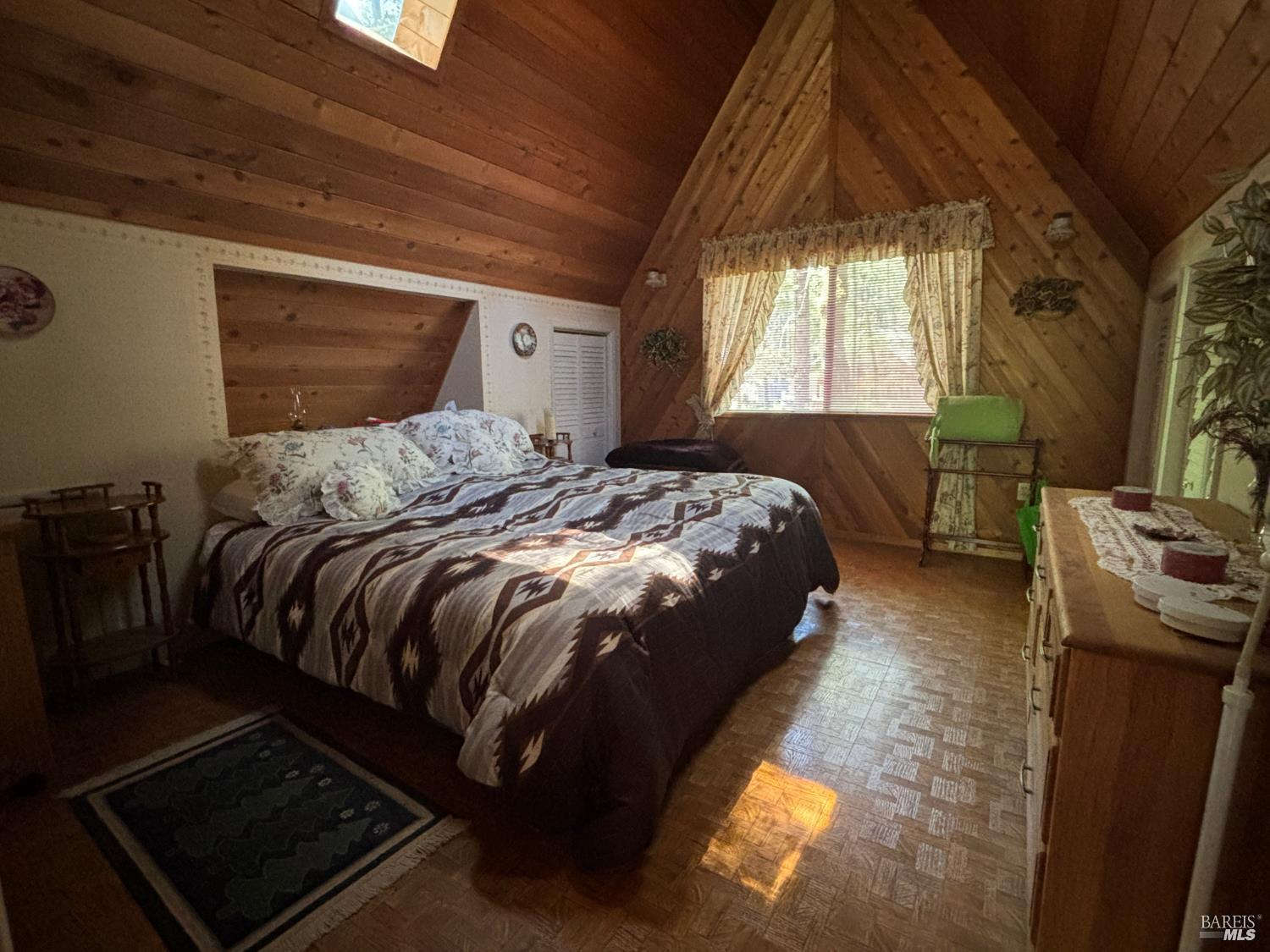 30518 Rodeo Road Potter Valley, CA 95469 - Photo 10 of 35 a bed sitting in a bedroom next to a window